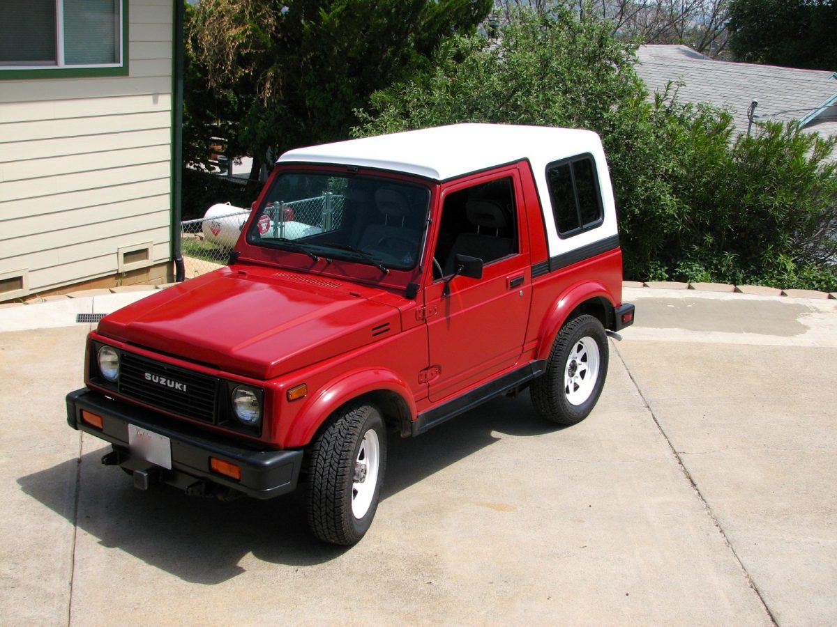 Hand-laid fiberglass Samurai hard top with tinted tempered glass and gray carpet interior